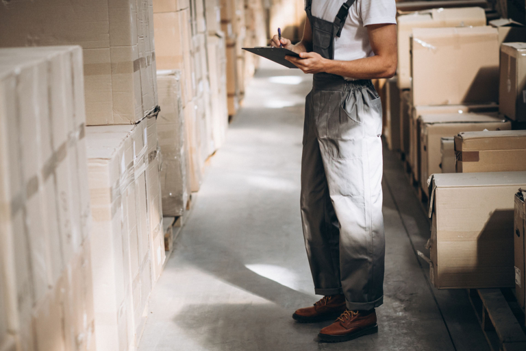 Young Man Working Warehouse With Boxes